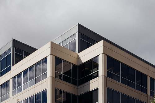 office building white concrete building during daytime architecture